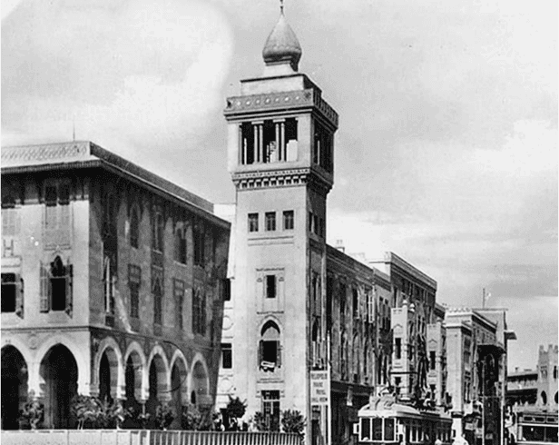 A high angle view of a building, showcasing the architecture in black and white. The image captures both indoor elements like an altar and outdoor surroundings.